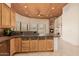 Kitchen with wood cabinets, granite counters and island at 751 E Moon Vista St, Apache Junction, AZ 85119