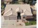 An aerial view showcasing a single-Gathering home with a three-car garage and a well-manicured lawn at 758 S Lagoon Dr, Gilbert, AZ 85233
