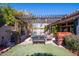 Landscaped backyard with a pergola, pool and firepit at 758 S Lagoon Dr, Gilbert, AZ 85233