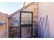 Exterior storage shed with a metal door and stone base at 758 S Lagoon Dr, Gilbert, AZ 85233