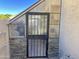 Charming greenhouse with stone and metal accents at 758 S Lagoon Dr, Gilbert, AZ 85233