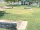 Outdoor horseshoe pit surrounded by grass and shade trees near the lake at 758 S Lagoon Dr, Gilbert, AZ 85233