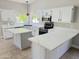 Bright kitchen with granite countertops, stainless steel appliances, and a kitchen island at 758 S Lagoon Dr, Gilbert, AZ 85233