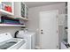 Laundry room with washer, dryer, and extra storage at 758 S Lagoon Dr, Gilbert, AZ 85233