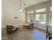 Spacious living room with vaulted ceilings, ceiling fan, and a view of the pool at 758 S Lagoon Dr, Gilbert, AZ 85233