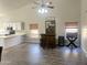 Living room featuring vaulted ceilings, tile flooring, a bar, and access to kitchen at 758 S Lagoon Dr, Gilbert, AZ 85233