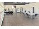 A spacious community center room with tables, chairs, light-colored floors and walls and natural light at 758 S Lagoon Dr, Gilbert, AZ 85233