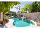 Inviting kidney shaped pool with surrounding landscaping at 758 S Lagoon Dr, Gilbert, AZ 85233