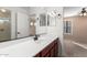 Bathroom with vanity, sink, and a view into a bedroom at 7712 S 72Nd Ave, Laveen, AZ 85339