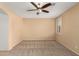 Bright bedroom with neutral walls, carpet, and ceiling fan at 7712 S 72Nd Ave, Laveen, AZ 85339