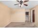 Spacious bedroom with ceiling fan and access to upper hallway at 7712 S 72Nd Ave, Laveen, AZ 85339