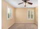 Bedroom with plantation shutters and ceiling fan at 7712 S 72Nd Ave, Laveen, AZ 85339