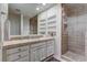 Bathroom with glass shower, built-in shelves, and single sink vanity at 8082 E Via Del Desierto --, Scottsdale, AZ 85258