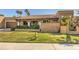 Spanish style home with tile roof, lush landscaping, and a grassy front yard at 8082 E Via Del Desierto --, Scottsdale, AZ 85258