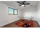 Cozy bedroom featuring a glass top desk and red rug at 8556 E Sage Dr, Scottsdale, AZ 85250