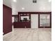 Open kitchen with white cabinets and stainless steel appliances at 9027 W Elm St # 5, Phoenix, AZ 85037