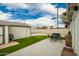 Backyard with artificial turf, shed, and patio at 906 E Whitton Ave, Phoenix, AZ 85014