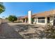 Spacious backyard with gravel and a view of the house at 9715 W Escuda Dr, Peoria, AZ 85382