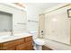 Clean bathroom with a shower/tub combo and wood-look floors at 9715 W Escuda Dr, Peoria, AZ 85382