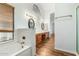 Main bathroom with soaking tub and double vanity at 9715 W Escuda Dr, Peoria, AZ 85382