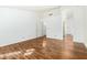 Bright bedroom with wood floors and access to bathroom at 9715 W Escuda Dr, Peoria, AZ 85382