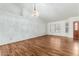 Dining room with wood-look tile floors and chandelier at 9715 W Escuda Dr, Peoria, AZ 85382