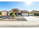 Single-story home with stone accents and a two-car garage at 9715 W Escuda Dr, Peoria, AZ 85382