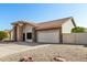 Single-story home with stone accents and a two-car garage at 9715 W Escuda Dr, Peoria, AZ 85382