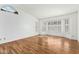Spacious living room with wood floors and bay window at 9715 W Escuda Dr, Peoria, AZ 85382
