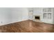 Living room with fireplace and wood-look tile floors at 9715 W Escuda Dr, Peoria, AZ 85382