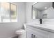 Modern bathroom with white vanity, quartz countertop, and walk-in shower at 10127 W Forrester Dr, Sun City, AZ 85351