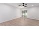 Spacious bedroom with ceiling fan and sliding glass door to patio at 10127 W Forrester Dr, Sun City, AZ 85351