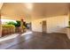 Covered carport with concrete flooring and access to house at 10127 W Forrester Dr, Sun City, AZ 85351