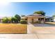 House exterior showcasing carport and well-maintained lawn at 10127 W Forrester Dr, Sun City, AZ 85351