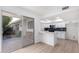 Bright kitchen features white shaker cabinets, quartz countertops, and modern appliances at 10127 W Forrester Dr, Sun City, AZ 85351