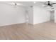 Open living area with neutral walls and light wood-look flooring at 10127 W Forrester Dr, Sun City, AZ 85351