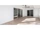 Spacious sunroom with light flooring and sliding glass doors at 10127 W Forrester Dr, Sun City, AZ 85351