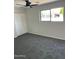 Spacious bedroom with grey carpet and double door closet at 10220 N 36Th N Ave, Phoenix, AZ 85051