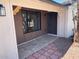 Inviting front porch with a stylish wood accent wall and updated flooring at 10220 N 36Th N Ave, Phoenix, AZ 85051