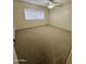Spacious bedroom with carpeted floors and a ceiling fan at 1051 N 84Th Pl, Scottsdale, AZ 85257