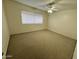 Bright bedroom featuring carpet and a ceiling fan at 1051 N 84Th Pl, Scottsdale, AZ 85257