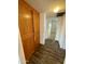 Hallway with wood-look floors and storage at 1051 N 84Th Pl, Scottsdale, AZ 85257
