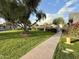 Green lawn space adjacent to the community pool at 1051 N 84Th Pl, Scottsdale, AZ 85257