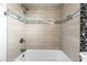 Clean bathroom with a tub and shower combination at 10723 E Mescal St, Scottsdale, AZ 85259