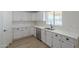 Well-equipped kitchen featuring white shaker cabinets and quartz countertops at 11214 S 203Rd Ln, Buckeye, AZ 85326