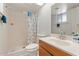 Small bathroom with shower/tub combo and wood vanity at 11624 N 25Th Ave, Phoenix, AZ 85029