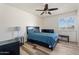 Bedroom with a queen bed, nightstand and ceiling fan at 11624 N 25Th Ave, Phoenix, AZ 85029