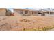 Large front yard with dirt and sparse vegetation at 11624 N 25Th Ave, Phoenix, AZ 85029