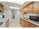 Kitchen boasts wood cabinets, ample counter space, and appliances at 11624 N 25Th Ave, Phoenix, AZ 85029
