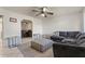 Living room with sectional sofa, coffee table, and ceiling fan at 11624 N 25Th Ave, Phoenix, AZ 85029